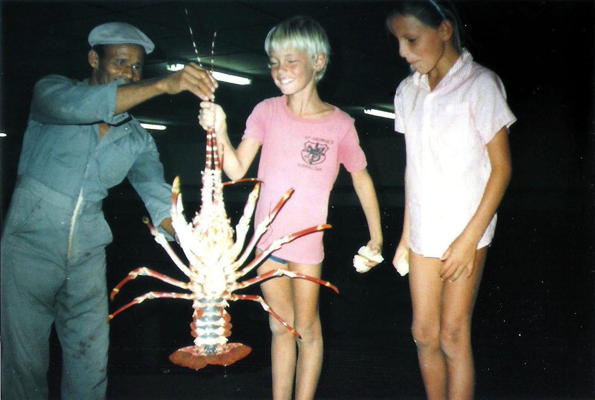 Antony holding up a large crayfish.